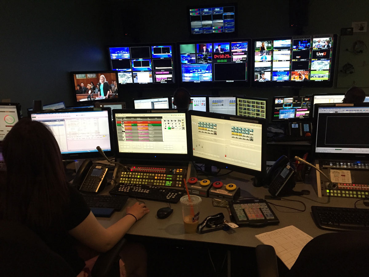 Multiple monitors in a dark TV production room