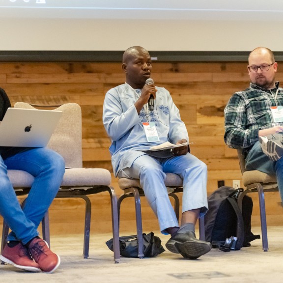 A panelist speaks at a conference