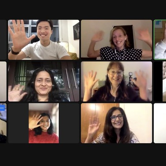People wave on an online call