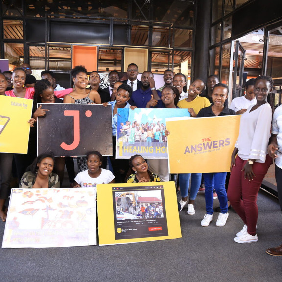 People pose at the MCI Media Hub 10 Year Sojo Party