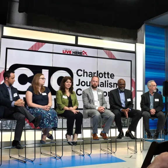 From left: CJC members Jim Yarbrough (of QNotes), Nate Morabito (WCNC), Lauren Lindstrom (Charlotte Observer), Hilda Gurdian (La Noticia), Seth Ervin (Charlotte-Mecklenburg Library), Glenn Burkins (QCityMetro), and David Boraks (WFAE). They are taking questions from co-moderator and WCNC anchor Fred Shropshire during an event in pre-pandemic times. (Photo courtesy Michael Davis)