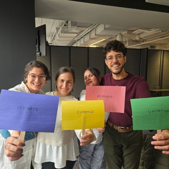 9 Millones staff model with their favorite pillar after THE BEST SOLUTIONS JOURNALISM GAME hosted by Linda at the Revenue Accelerator. Photo by Melissa Casutte
