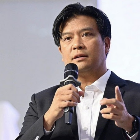 A man speaks into a microphone