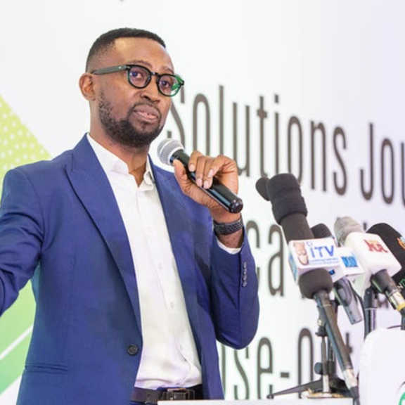 Chibuike Alagboso speaks into a microphone