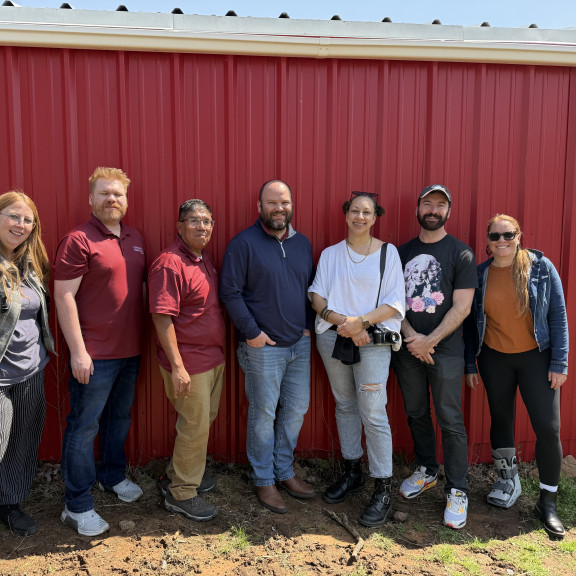 SJN Staff and coaches with the staff of Cherokee Phoenix. Courtesy of Angela K. Evans.