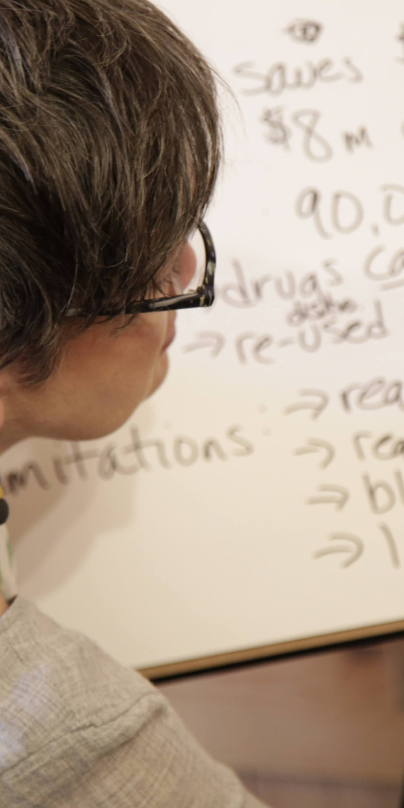 Woman writes on a poster