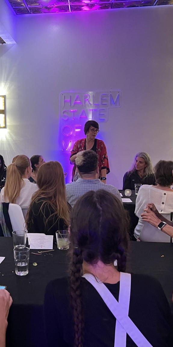 Participants in Climate Week 2023 sit together