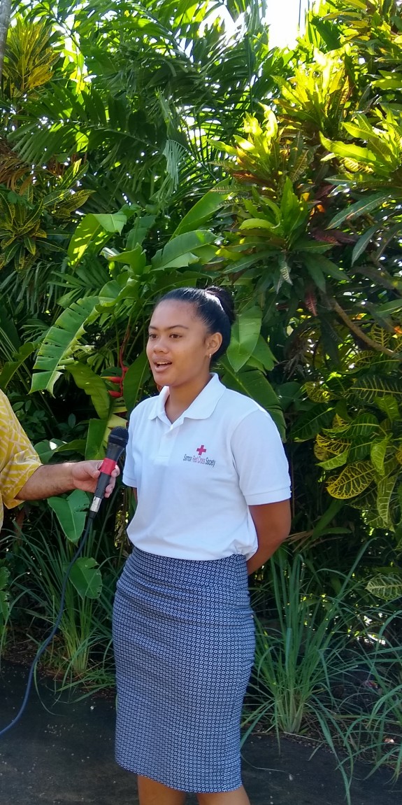 A women is interviewed on camera