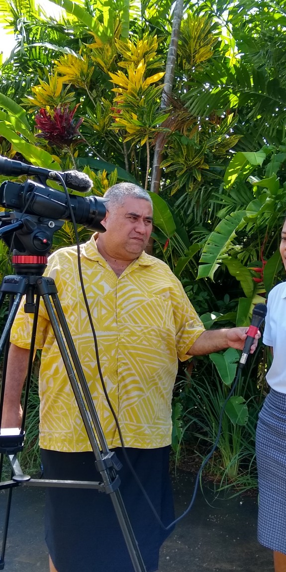 A woman is interviewed on camera