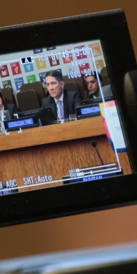 A video camera records speakers on a UN panel