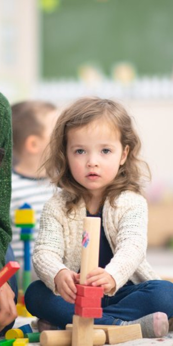 A child plays with blocks