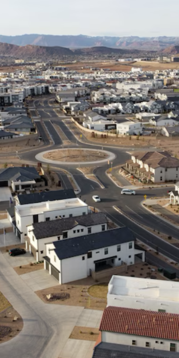 (Jud Burkett | Special to The Tribune) A variety of homes and condominiums in various states of construction near the Arizona-Utah state line in St. George, Thursday, March 20, 2025. A moderate-income housing program is intended to result in more housing options and variety like this neighborhood and more affordability to households earning 80% or less in the state’s biggest cities and counties.