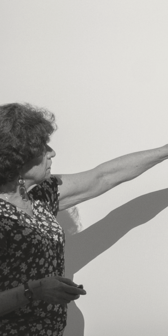 A woman points to a presentation showing Medicare supplement plans