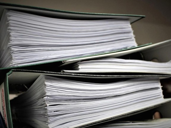 stacked report binders
