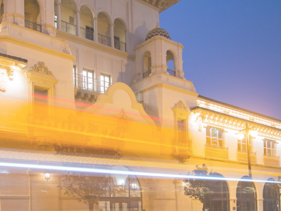 The California Center building is illuminated in bright golden light