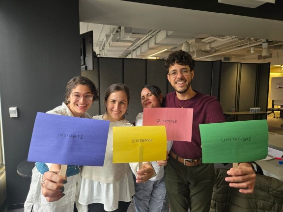 9 Millones staff model with their favorite pillar after THE BEST SOLUTIONS JOURNALISM GAME hosted by Linda at the Revenue Accelerator. Photo by Melissa Casutte