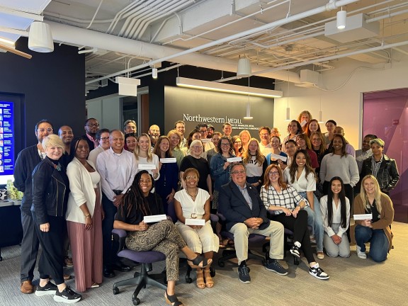 Journalists and newsroom leaders pose for a group photo during a program kickoff meeting in Chicago