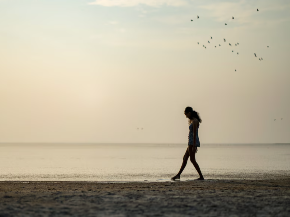 A person walks along the lakefront. Credit: Rick Egan, The Salt Lake Tribune