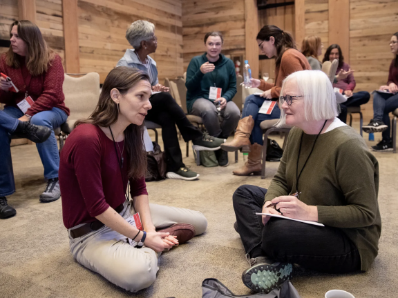 Journalists pair up and speak with each other at the SJN Summit