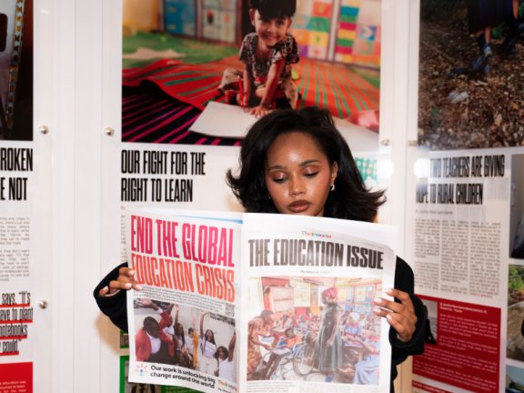 A women reads The Education Issue of the newspaper