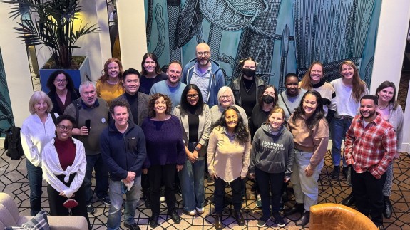 The SJN team poses for a photo during a 2025 team retreat in Seattle.