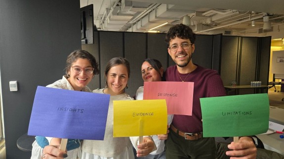 9 Millones staff model with their favorite pillar after THE BEST SOLUTIONS JOURNALISM GAME hosted by Linda at the Revenue Accelerator. Photo by Melissa Casutte