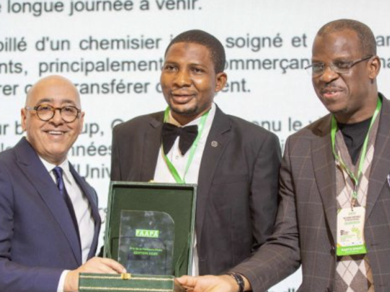 Usman Aliyu receiving the 2025 Award of the Atlantic Federation of African Press Agencies (FAAPA) for Best Feature Article