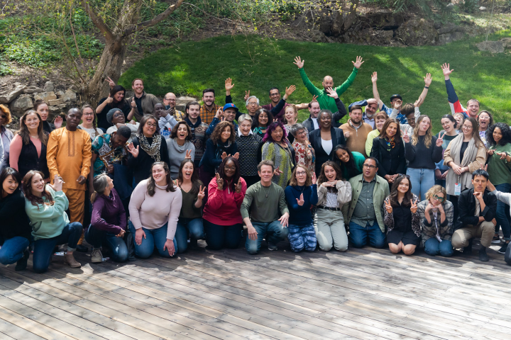 Participants in an SJN Summit smile and pose for the camera