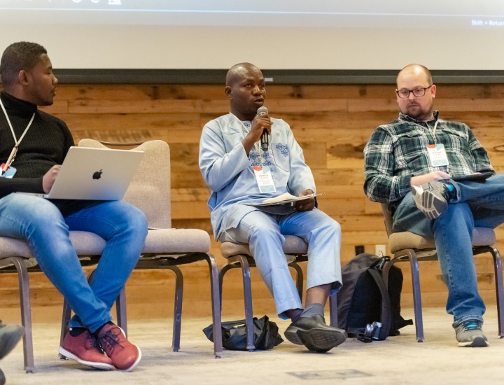 A panelist speaks at a conference