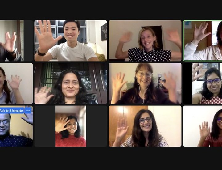 People wave on an online call