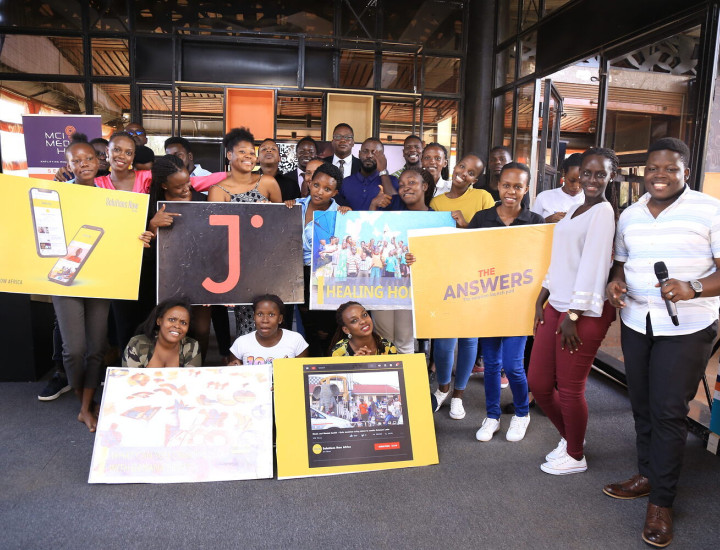 People pose at the MCI Media Hub 10 Year Sojo Party