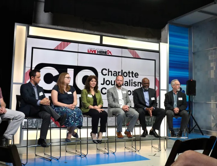 From left: CJC members Jim Yarbrough (of QNotes), Nate Morabito (WCNC), Lauren Lindstrom (Charlotte Observer), Hilda Gurdian (La Noticia), Seth Ervin (Charlotte-Mecklenburg Library), Glenn Burkins (QCityMetro), and David Boraks (WFAE). They are taking questions from co-moderator and WCNC anchor Fred Shropshire during an event in pre-pandemic times. (Photo courtesy Michael Davis)