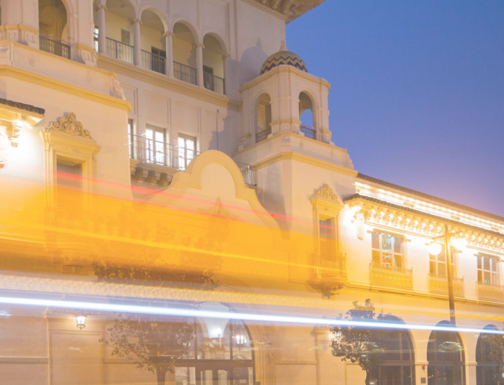 The California Center building is illuminated in bright golden light