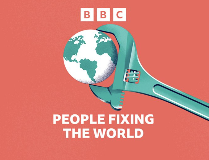 A wrench holds a globe