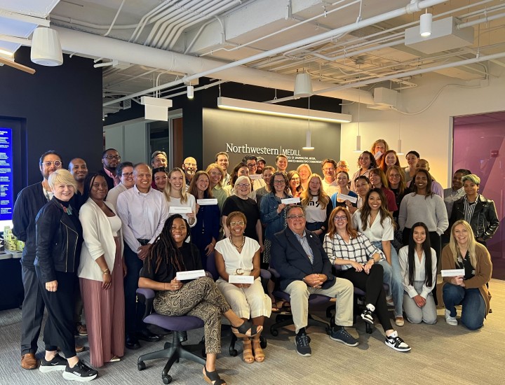 Journalists and newsroom leaders pose for a group photo during a program kickoff meeting in Chicago