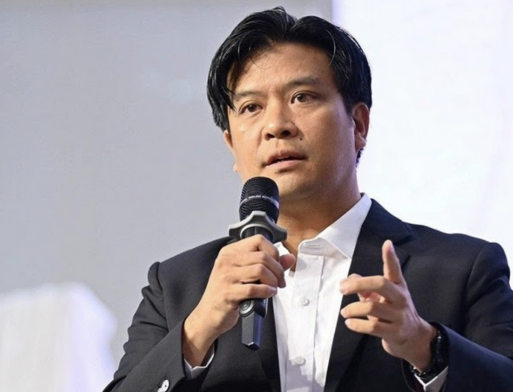 A man speaks into a microphone