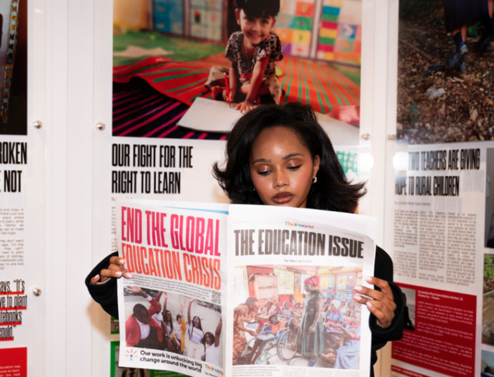 A women reads The Education Issue of the newspaper