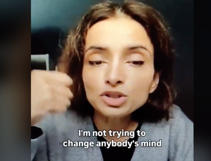A woman speaks on camera saying "I am not trying to change anybody's mind"