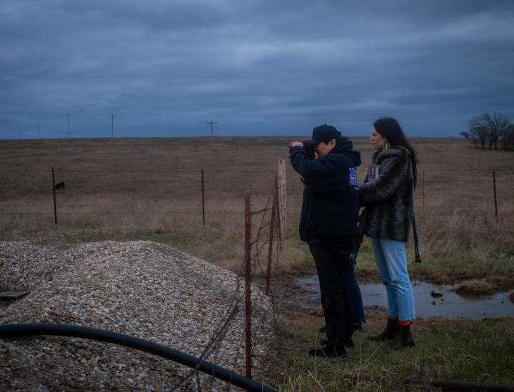 Two people take photos outside. Photo by Tara Pixley