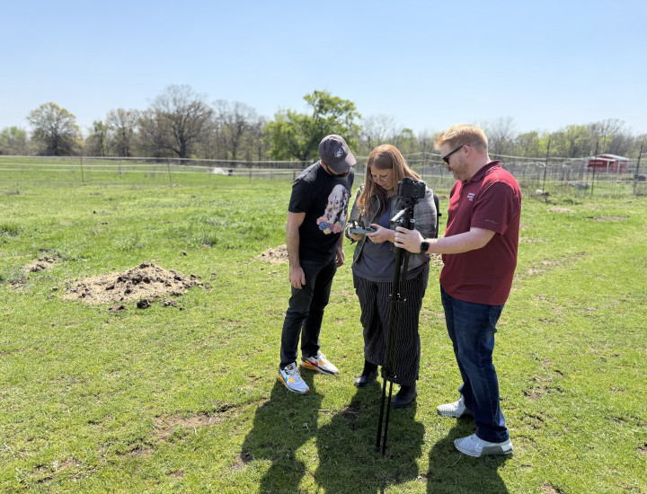 SJN coach Justin Cook with the staff of Cherokee Phoenix. Courtesy of Angela K. Evans