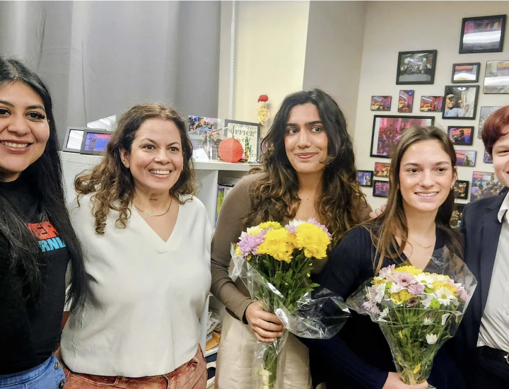 Five people pose for a photo. Photo courtesy of KALW